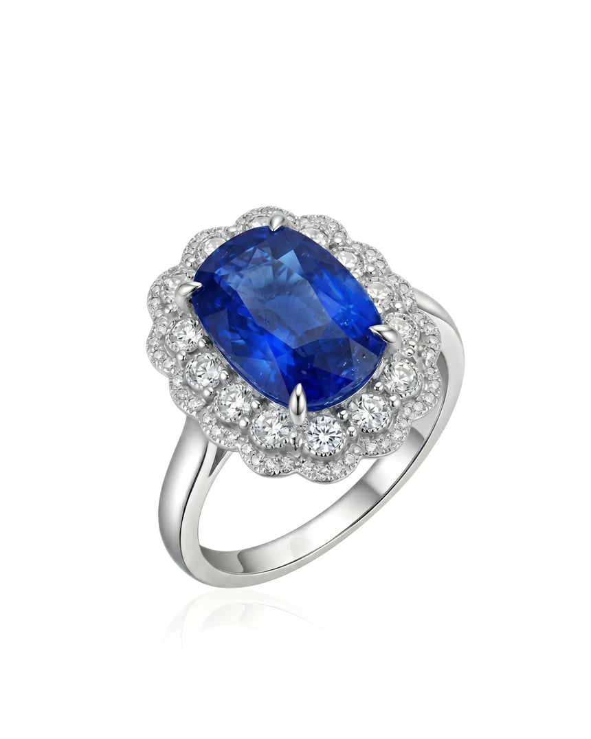 Royal blue cushion sapphire ring with scalloped diamond halo in platinum | SARATTI