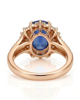Royal blue oval sapphire ring with bright diamond halo in 18K rose gold | SARATTI