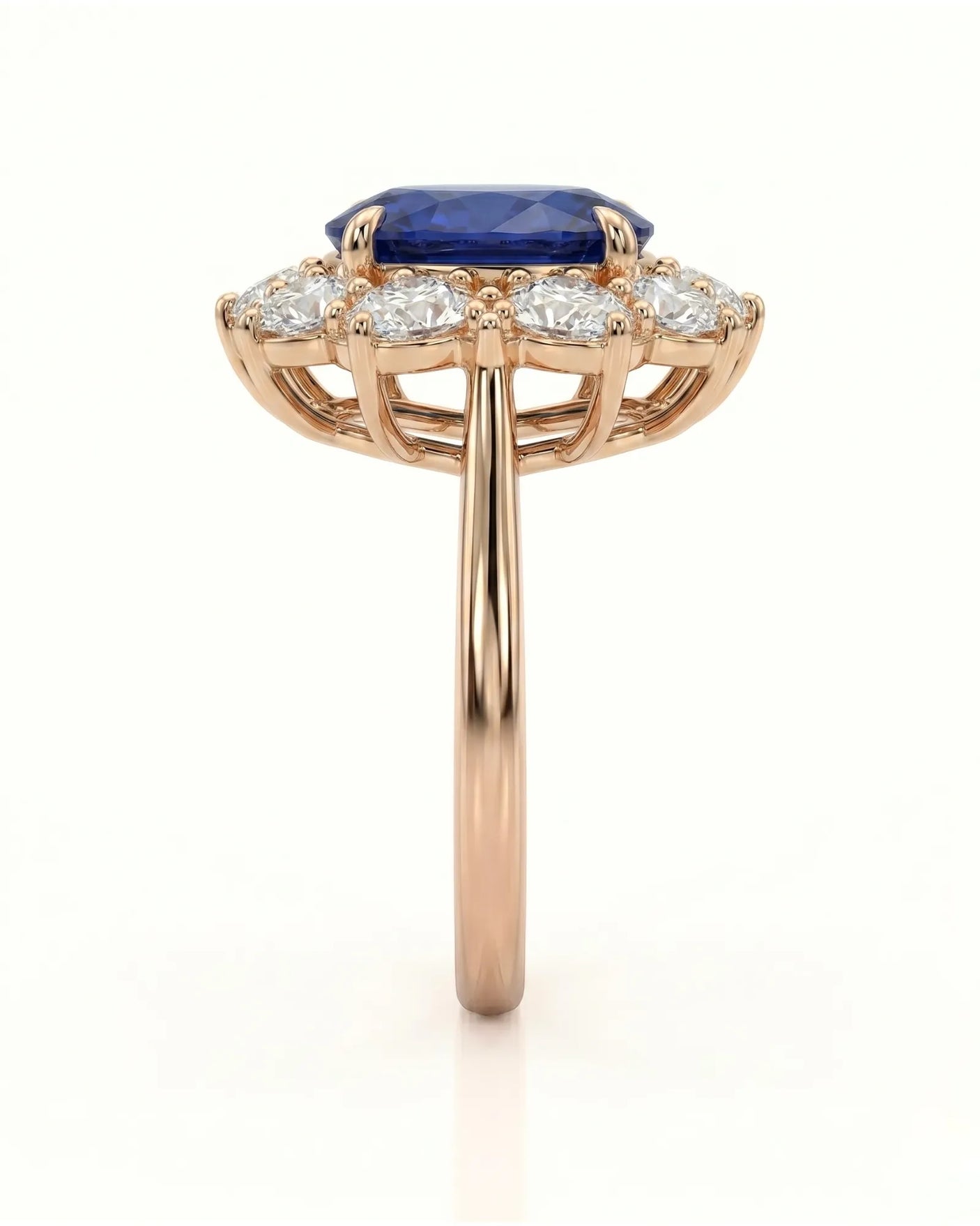 Royal blue oval sapphire ring with brilliant diamond halo in 18K rose gold | SARATTI
