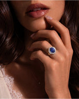 Royal blue oval sapphire ring with diamond halo in 18K yellow gold | SARATTI