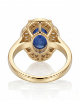 Royal blue sapphire engagement ring with diamond halo for vintage proposals in 18K yellow gold | SARATTI