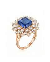 Royal blue sapphire ring with emerald-cut center and diamond floral halo in 18K rose gold | SARATTI