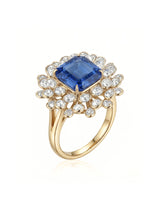 Royal blue sapphire ring with emerald-cut center and diamond floral halo in 18K yellow gold | SARATTI