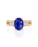Royal blue sapphire split shank ring with floral diamond settings in 18K rose gold | SARATTI