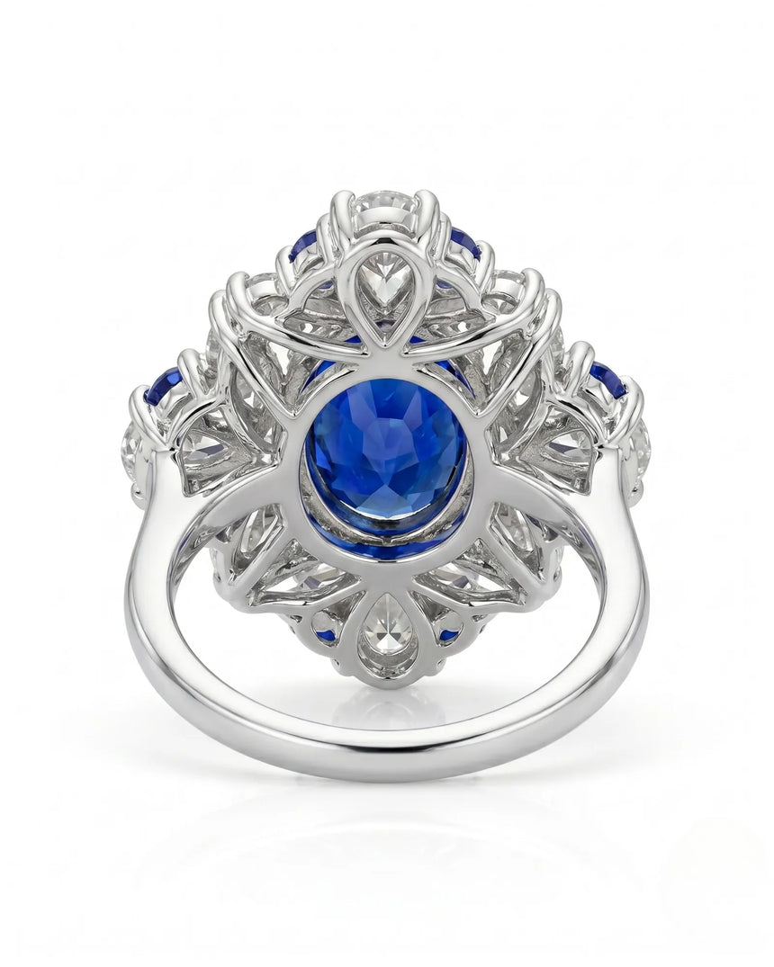 Royal sapphire ring with pear marquise and round diamond halo in platinum | SARATTI