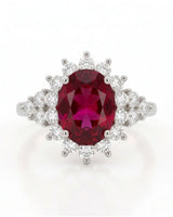 Rubellite tourmaline engagement ring with diamond halo in timeless platinum | SARATTI