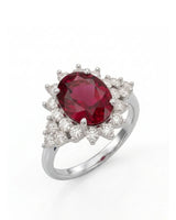 Rubellite tourmaline ring with oval center stone and diamond halo in 18K white gold | SARATTI