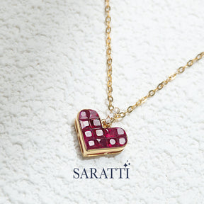 Close up shot of the Alma Rosa Ruby Heart Necklace | Saratti Fine Jewelry 