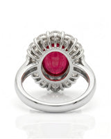 Ruby and diamond anniversary ring with oval center stone in 18K white gold | SARATTI