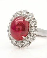 Ruby and diamond anniversary ring with oval center stone in elegant platinum | SARATTI
