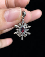 Ruby and diamond snowflake pendant worn on a fine chain for elegant occasion styling | SARATTI