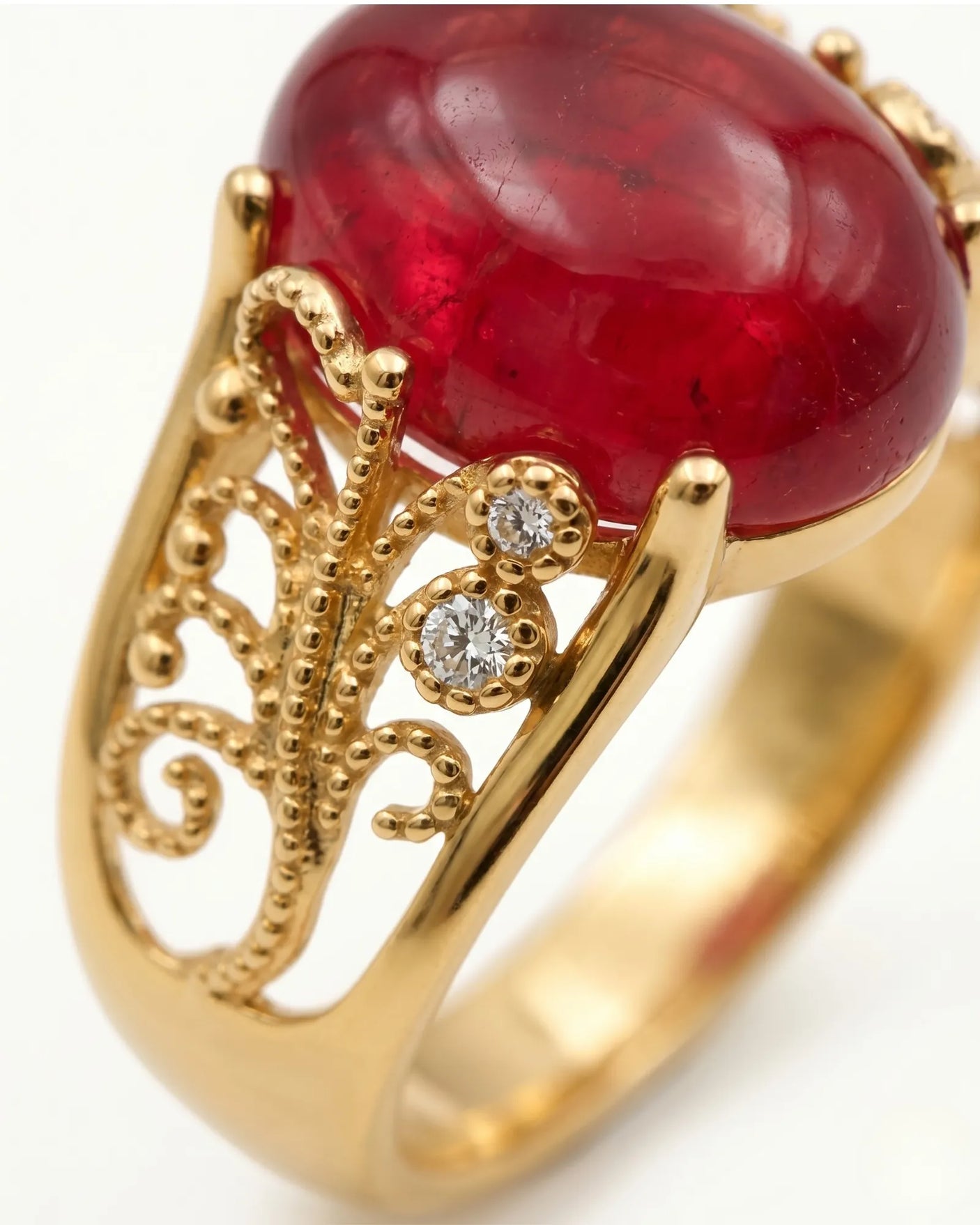Ruby and diamond statement ring with artistic scrollwork in 18K yellow gold | SARATTI