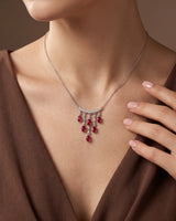 Ruby cascade necklace with graduated hanging tassels, curved diamond bar and refined platinum construction | SARATTI