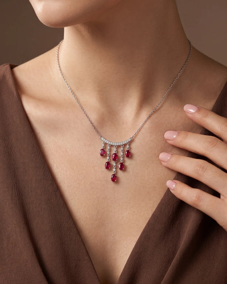 Ruby cascade necklace with graduated hanging tassels, curved diamond bar and refined platinum construction | SARATTI