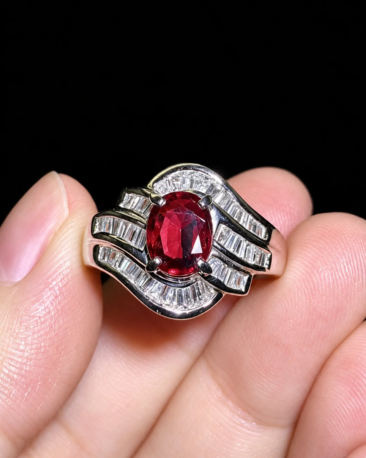 Ruby statement ring with curved baguette diamond bands in polished platinum - SARATTI