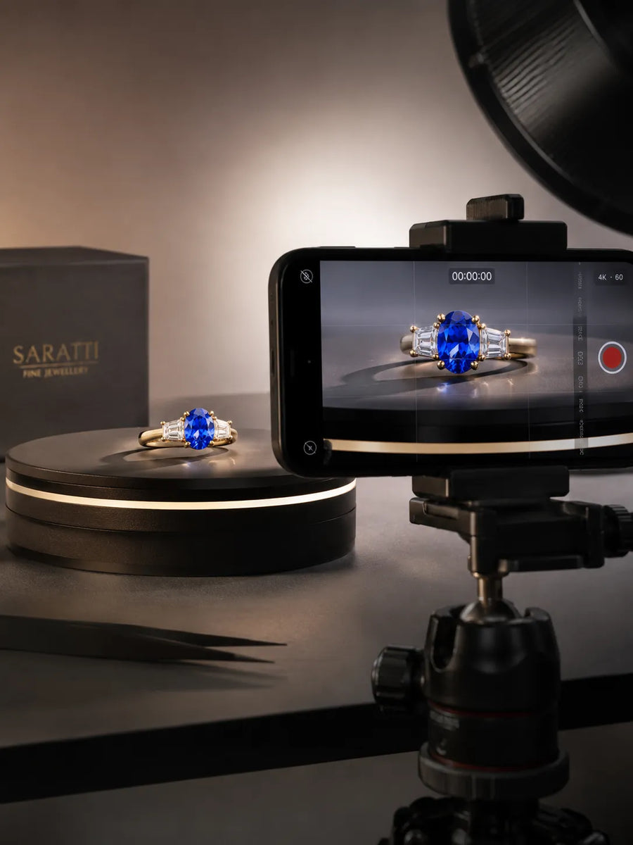 Behind-the-scenes SARATTI 4K film setup showing a sapphire and diamond ring on a rotating display captured for client review