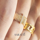 Sculptural gold band with diamond detailing inspired by historic colonnade architecture | SARATTI