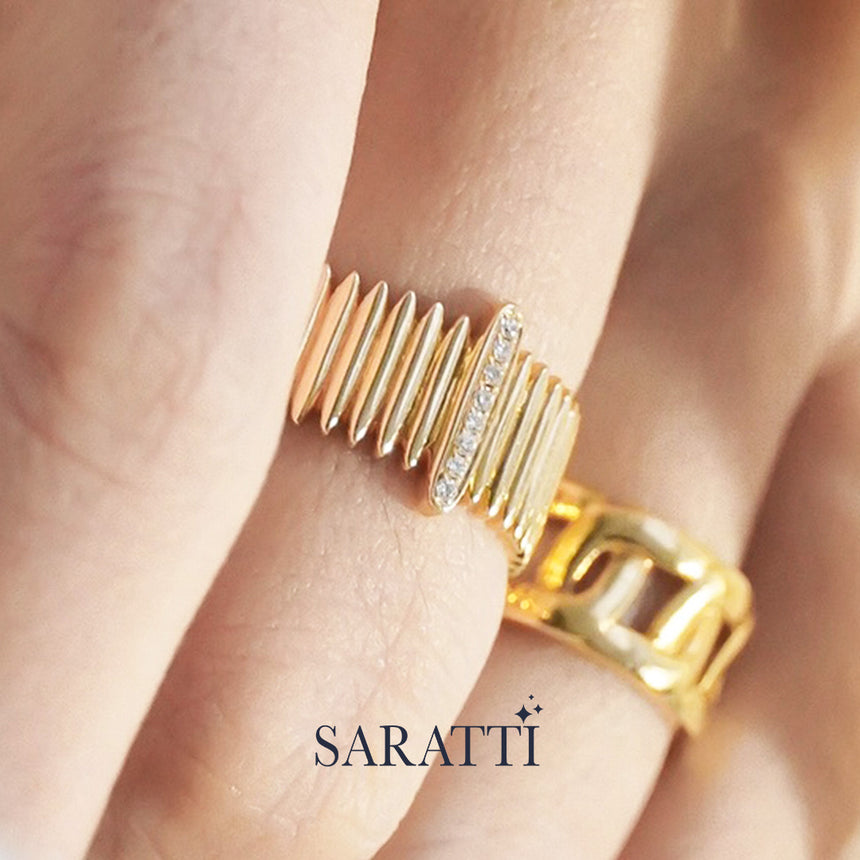 Sculptural gold band with diamond detailing inspired by historic colonnade architecture | SARATTI