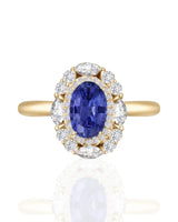 Sapphire and diamond anniversary ring with timeless halo in 18K yellow gold | SARATTI
