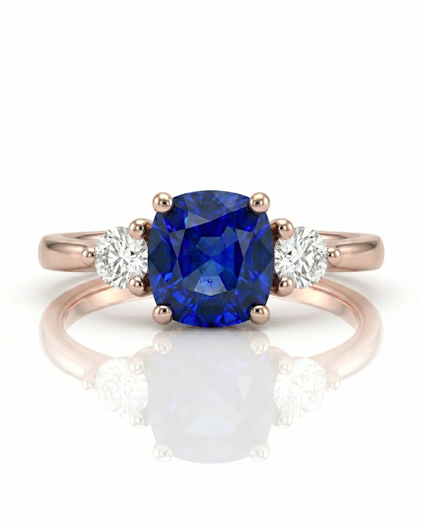 Sapphire and diamond engagement ring with classic three-stone design in rose gold | SARATTI