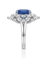Sapphire and diamond engagement ring with regal floral design in 18K white gold | SARATTI