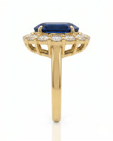Sapphire and diamond engagement ring with romantic halo design in 18K yellow gold | SARATTI