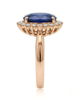 Sapphire and diamond engagement ring with royal halo design in rose gold | SARATTI