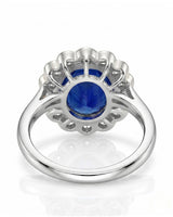 Sapphire and diamond engagement ring with vintage floral halo in platinum | SARATTI