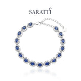Sapphire tennis bracelet with oval halo settings | SARATTI