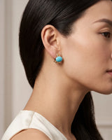 Sculpted 18K yellow gold turquoise earrings with vivid blue oval cabochons and ribbed detailing | SARATTI