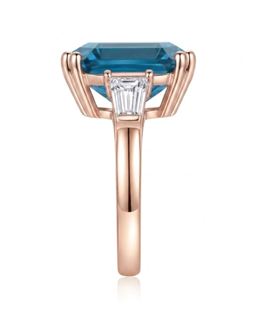 Sculptural blue topaz ring with double-claw corners and geometric diamond sides in 18K rose gold | SARATTI