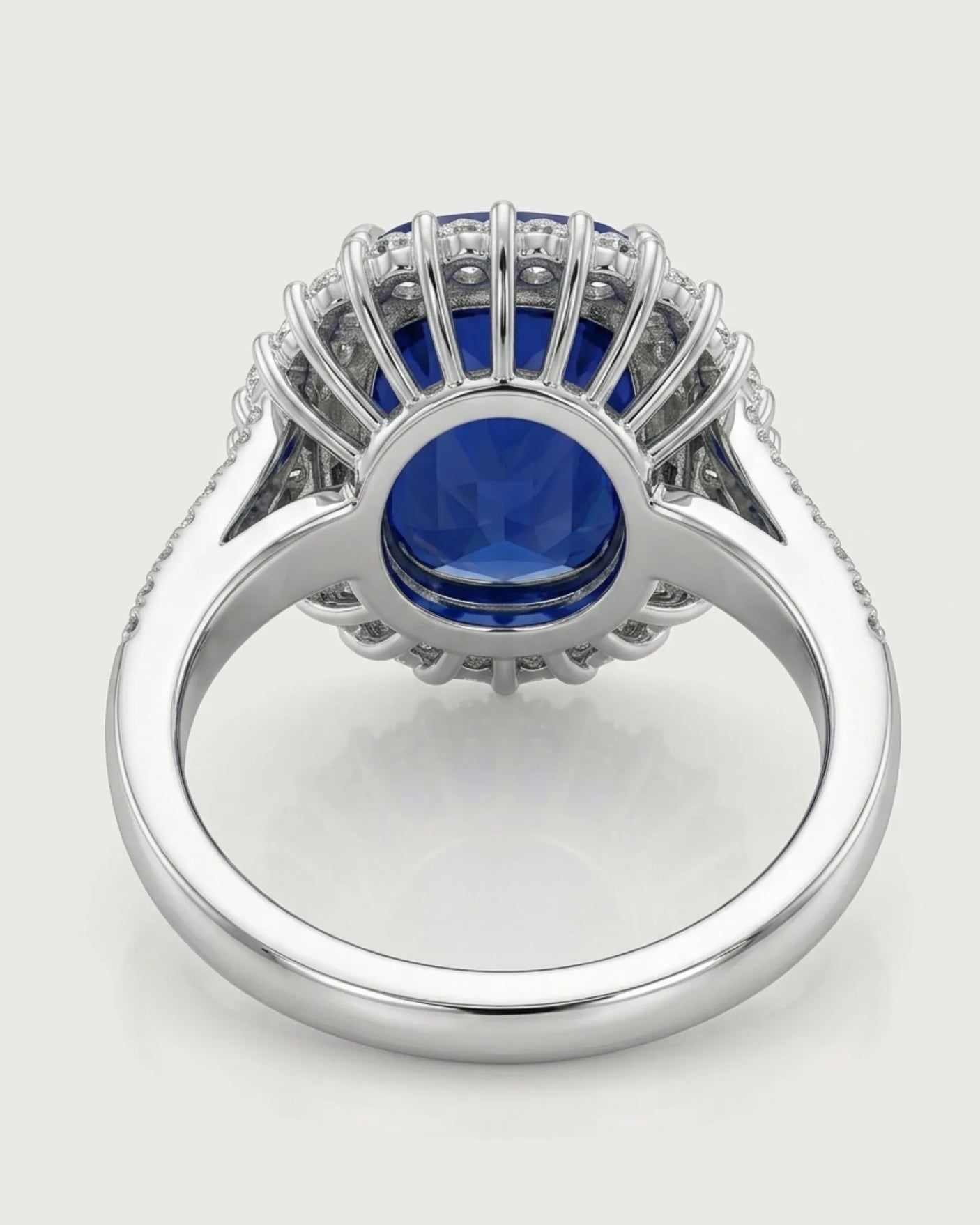 Sculptural platinum sapphire ring featuring fan set baguette diamonds and brilliant round accents - SARATTI
