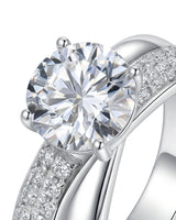 Sculptural split shank moissanite ring with polished ribbon and pavé detailing crafted in platinum | SARATTI