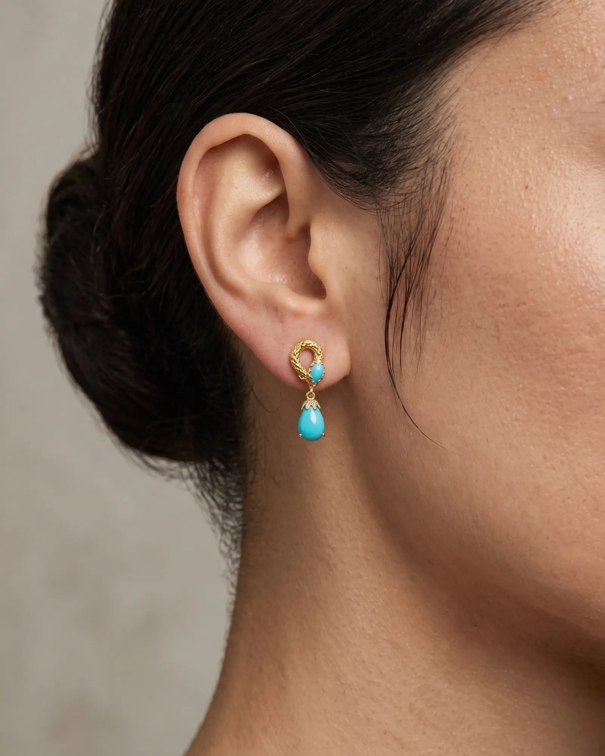 Serpent-inspired blue pine earrings with textured detailing and diamond accents in 18K yellow gold | SARATTI