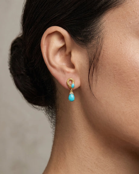 Serpent-inspired blue pine earrings with textured detailing and diamond accents in 18K yellow gold | SARATTI