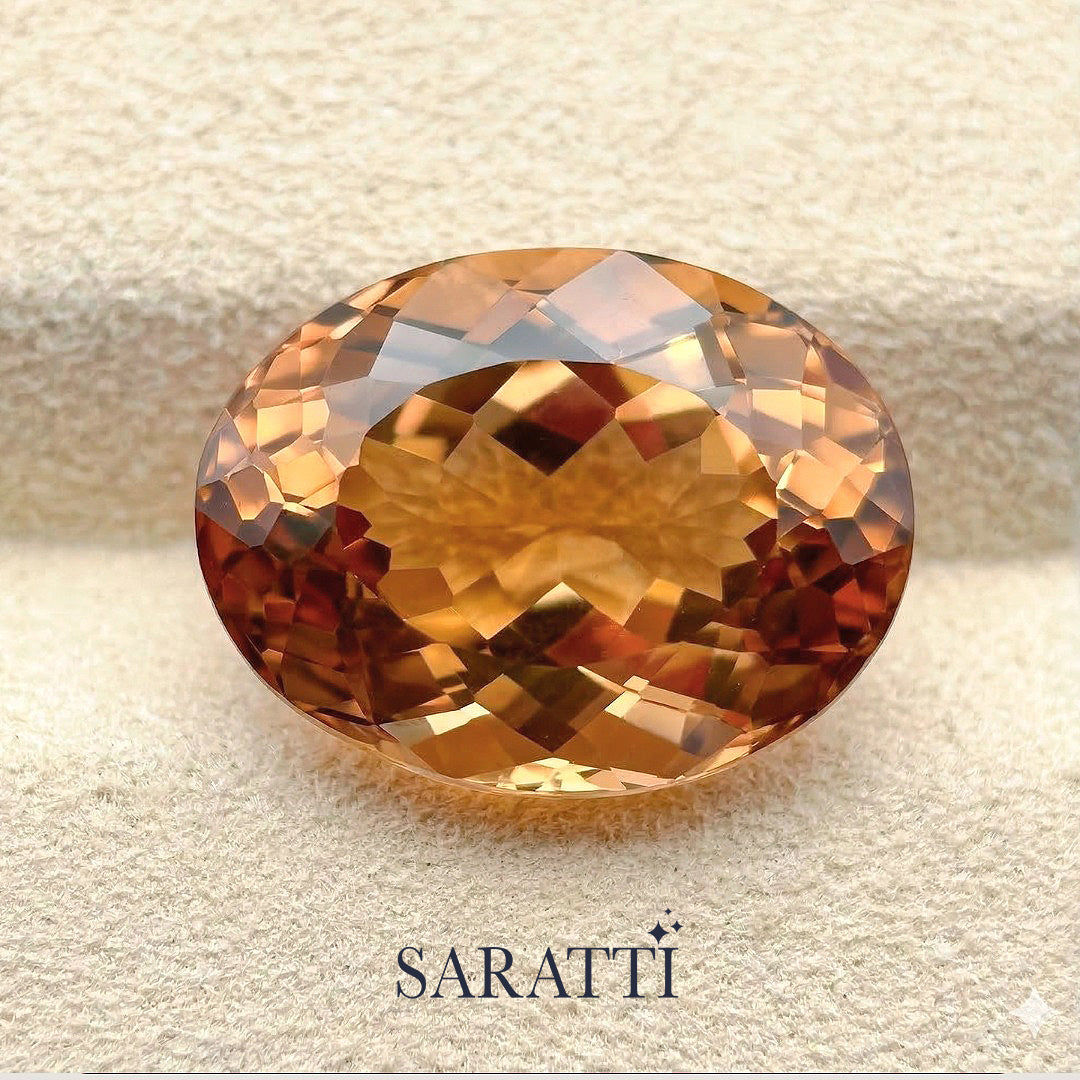Side profile of 13.65 carat Imperial Topaz oval gemstone | SARATTI
