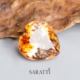 Side profile of 8.00 carat Imperial Topaz heart gemstone | SARATTI