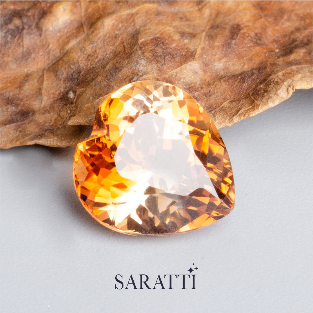 Side profile of 8.00 carat Imperial Topaz heart gemstone | SARATTI