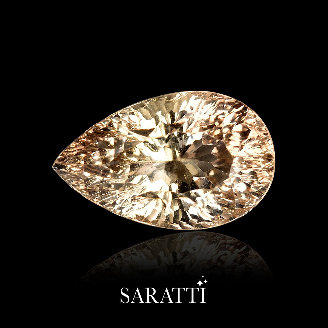 Side profile of 8.62 carat Imperial Topaz pear gemstone | SARATTI