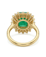 Side profile of CELESTINE emerald cocktail ring showing raised basket and diamond-set shoulders | SARATTI