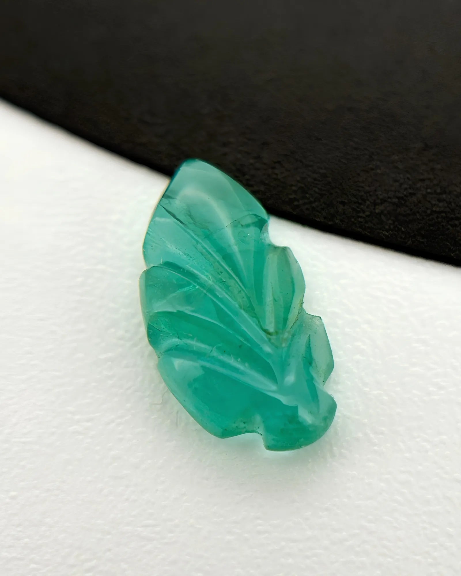 Side profile of Natural Emerald leaf showing carved relief depth - SARATTI