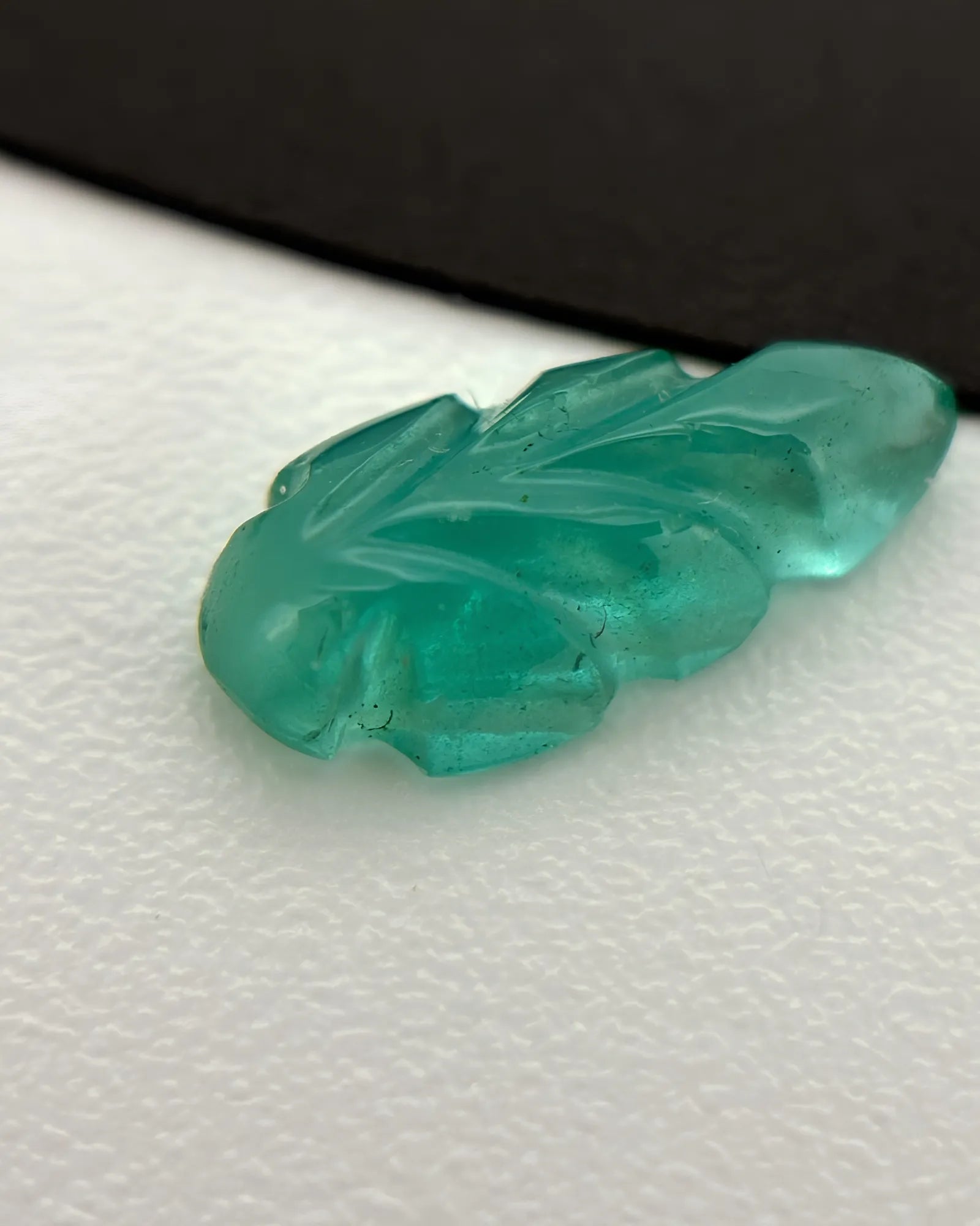 Side profile of Natural Emerald leaf showing carved relief depth | SARATTI