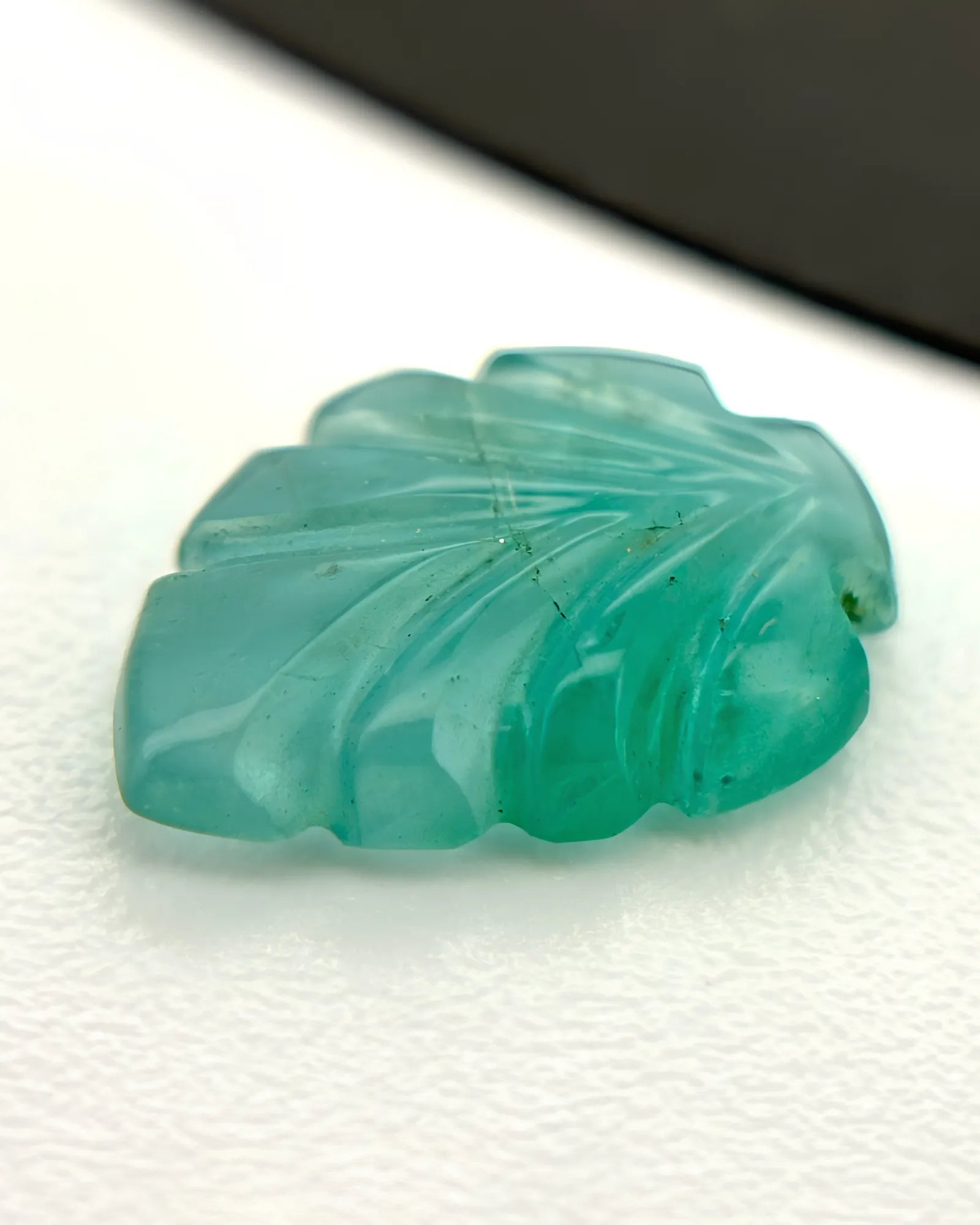 Side profile of Natural Emerald leaf showing carved relief depth | SARATTI