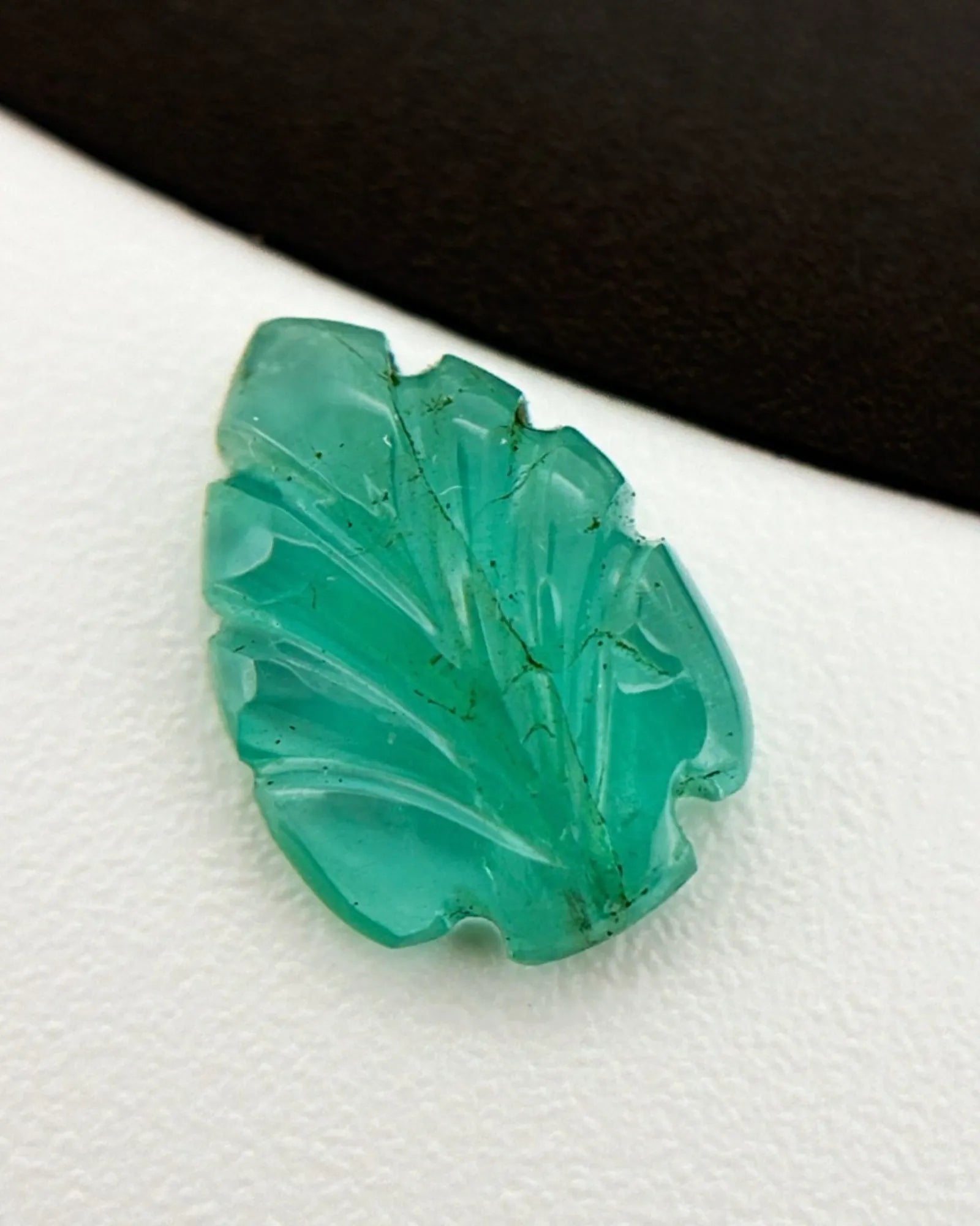 Side profile of Natural Emerald leaf showing sculpted relief depth | SARATTI