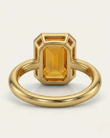 Side view emerald cut Imperial Topaz halo setting yellow gold | SARATTI