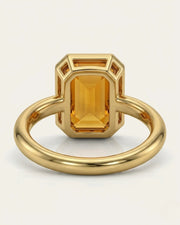Side view emerald cut Imperial Topaz halo setting yellow gold | SARATTI