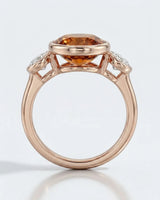 Smooth bezel setting frames the Imperial Topaz in a secure oval form in rose gold | SARATTI