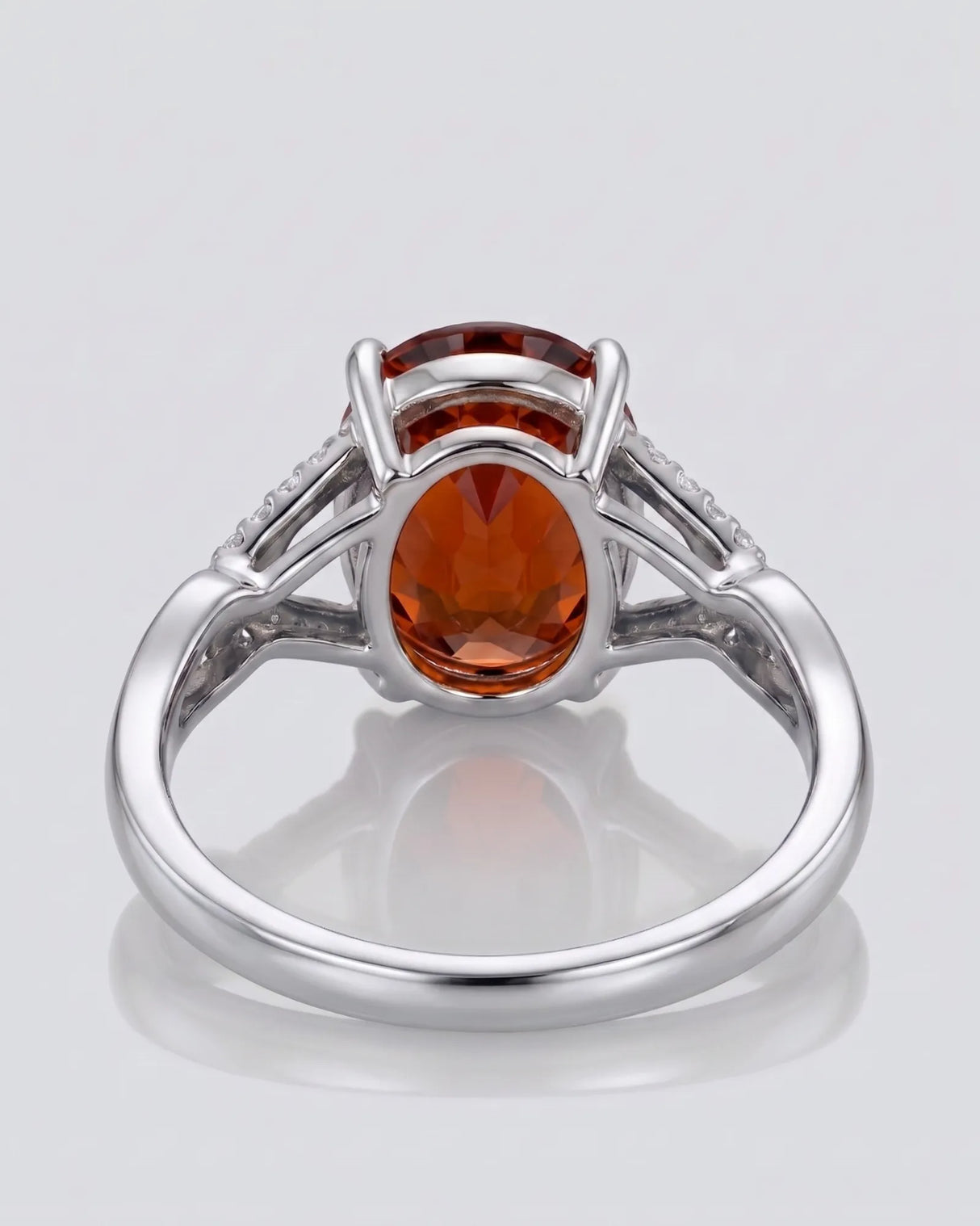 Solara diamond frame garnet ring with oval gemstone in polished platinum | SARATTI