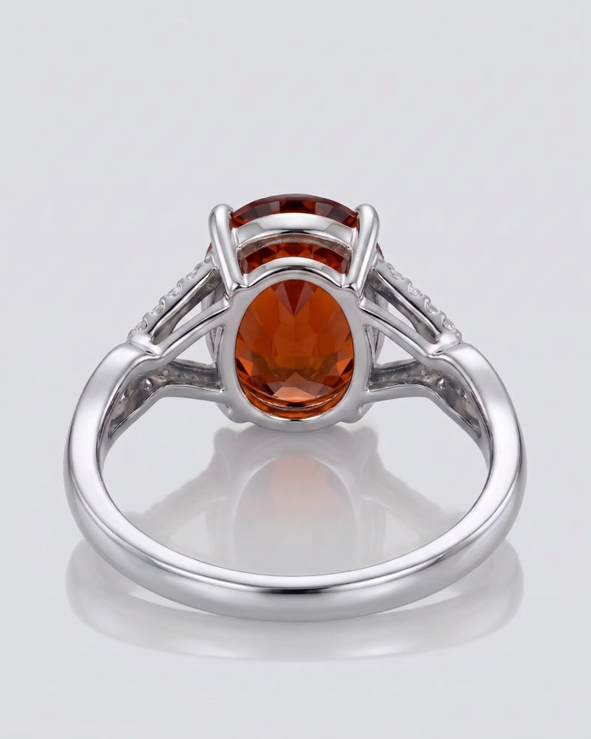 Solara diamond frame garnet ring with oval gemstone in polished platinum | SARATTI