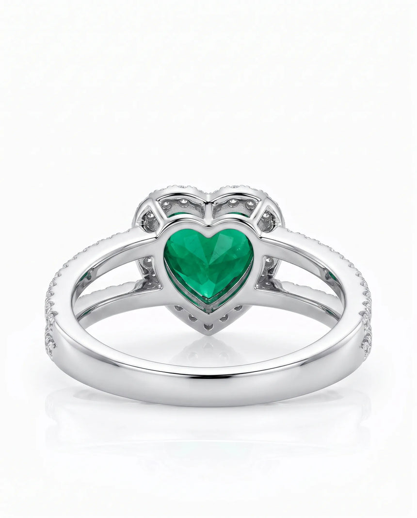 Split shank emerald ring with diamonds in 18K white gold | SARATTI